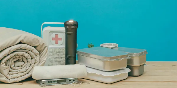 Wildfire emergency kit supplies on a table.