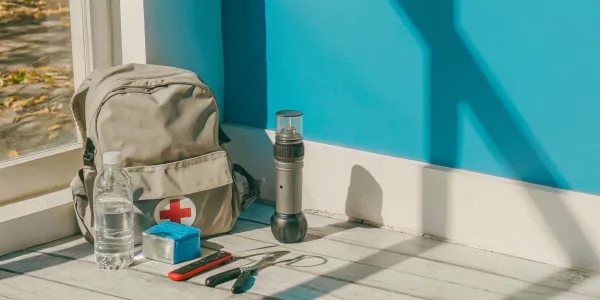 Wildfire go bag: first aid kit, water, flashlight, multitool, hygiene items.